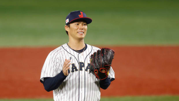 Aug 4, 2021; Yokohama, Japan; Team Japan pitcher Yoshinobu Yamamoto (17) reacts against Korea in a baseball semifinal match during the Tokyo 2020 Olympic Summer Games at Yokohama Baseball Stadium. Mandatory Credit: Yukihito Taguchi-USA TODAY Sports